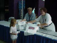 Angelle picks up Goody bag and t-shirt